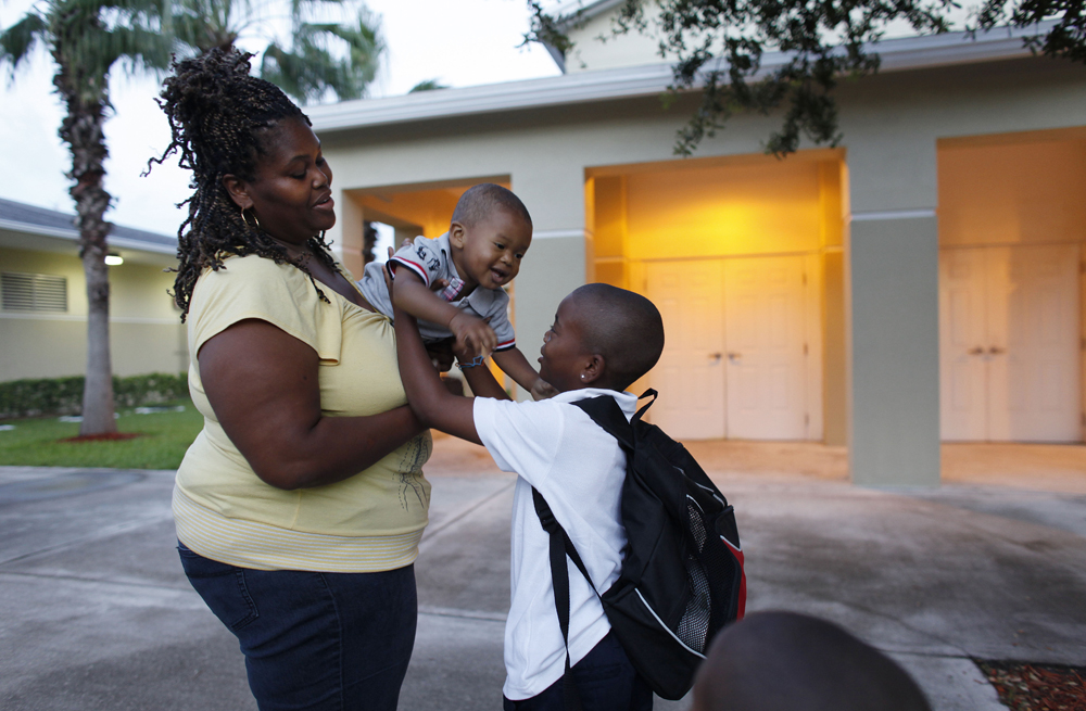 African American mom playing with her two kids