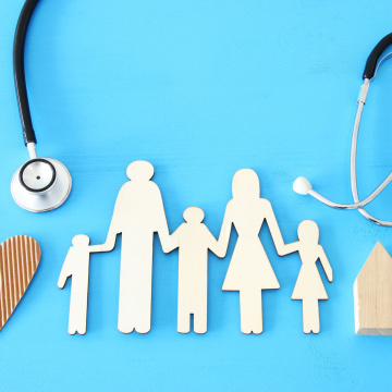 paper cutout of a family holding hands