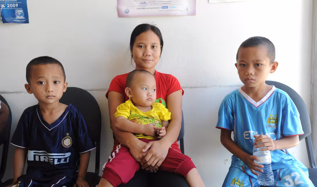 A mother and three children at a healthcare provider